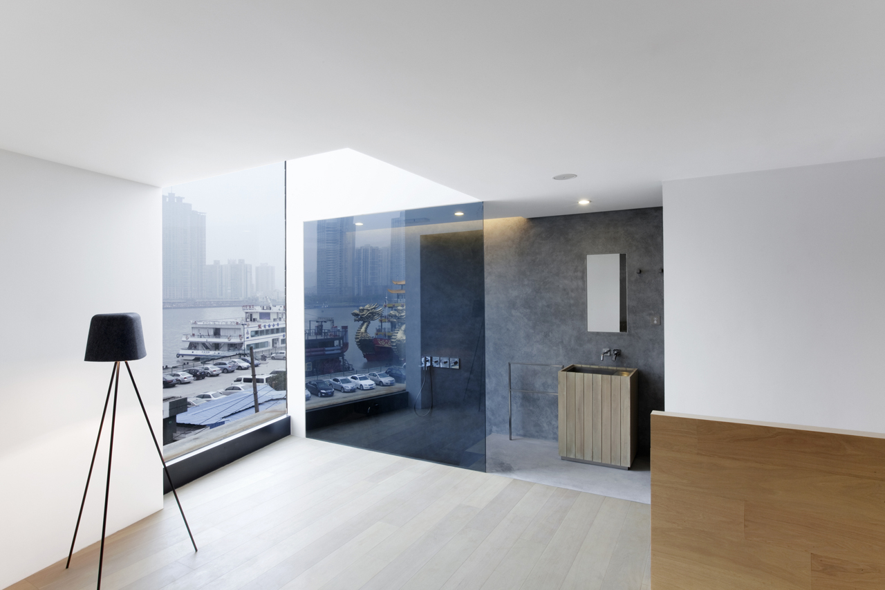 Hotel room inside the Waterhouse at South Bund located in  Shanghai, China designed by Neri & Hu Design and Research Office (NHDRO)